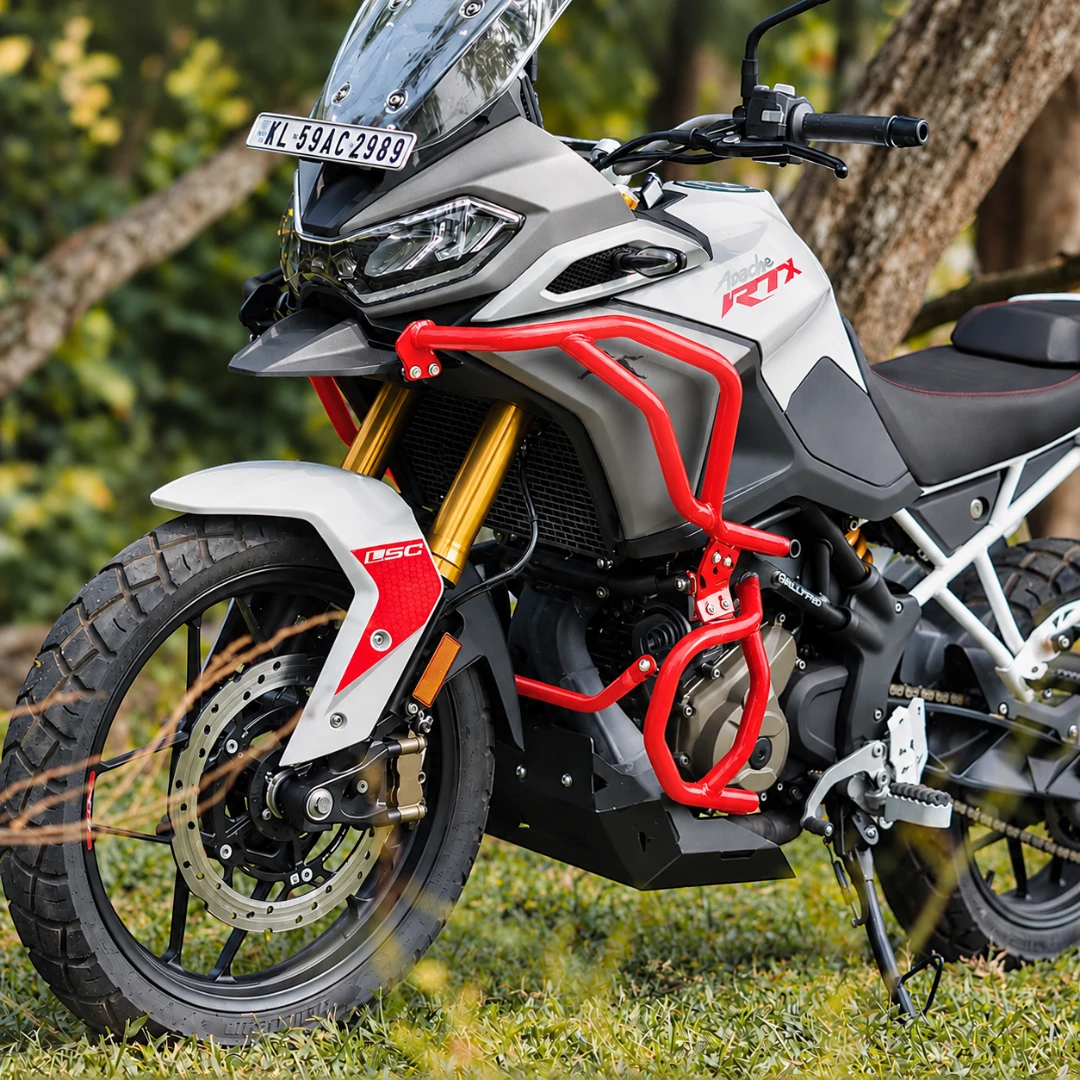 Legundary Raptor red crash guard set installed on a white TVS Apache RTX 300 adventure motorcycle