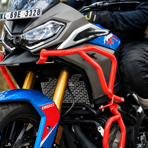 Legundary Raptor red steel crash guard set installed on a blue and grey TVS Apache RTX 300 motorcycle