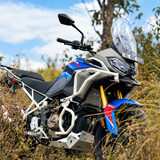 White Legundary Raptor crash guard set installed on a blue and grey TVS Apache RTX 300 adventure motorcycle