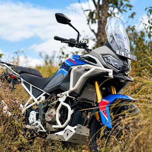 White Legundary Raptor crash guard set installed on a blue and grey TVS Apache RTX 300 adventure motorcycle
