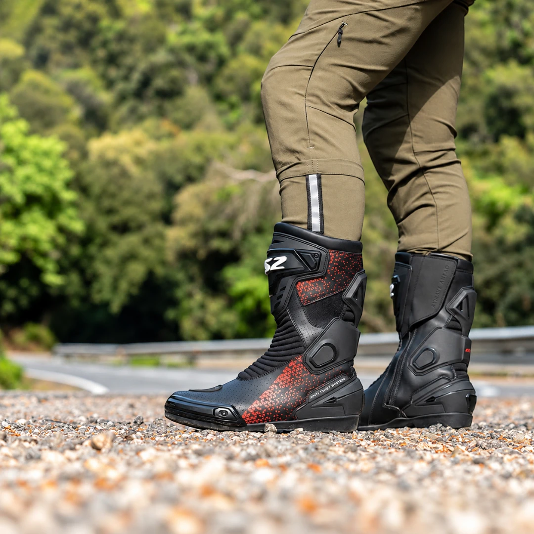 LS2 Assault motorcycle boots in black and red, featuring perforated leather and protective side panels.
