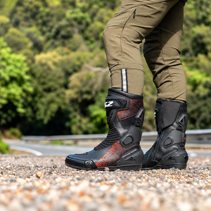 LS2 Assault motorcycle boots in black and red, featuring perforated leather and protective side panels.