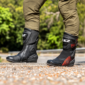 LS2 Assault motorcycle boots in black and red, featuring perforated leather and protective TPU elements.