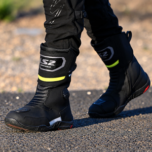 LS2 Goby waterproof black leather motorcycle touring boots with reflective details worn on a rider