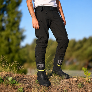 LS2 Goby waterproof touring motorcycle boots in black with reflective details worn by a rider outdoors