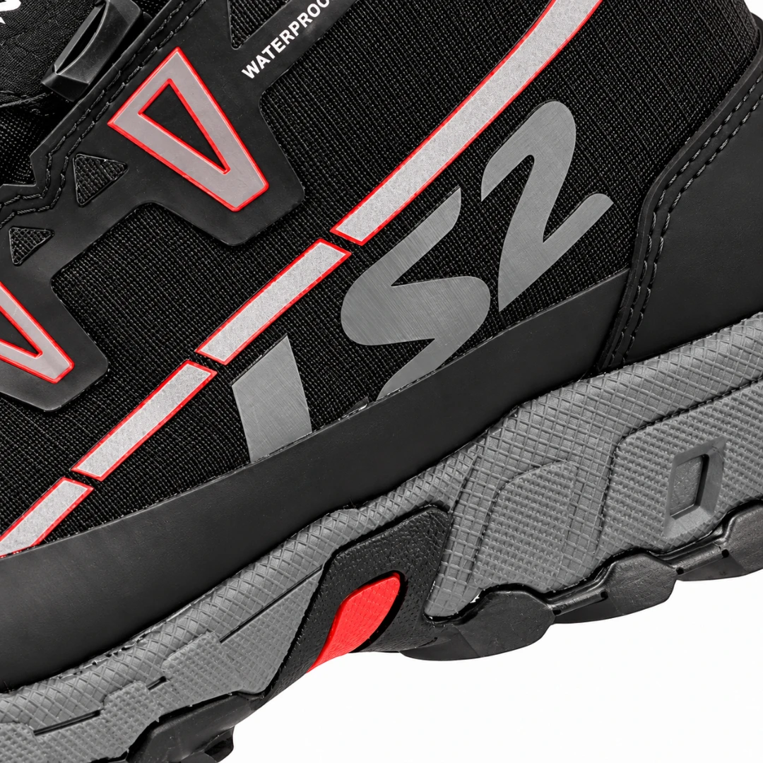LS2 Trekker waterproof motorcycle boot side detail featuring black ripstop fabric, red accents, and logo.