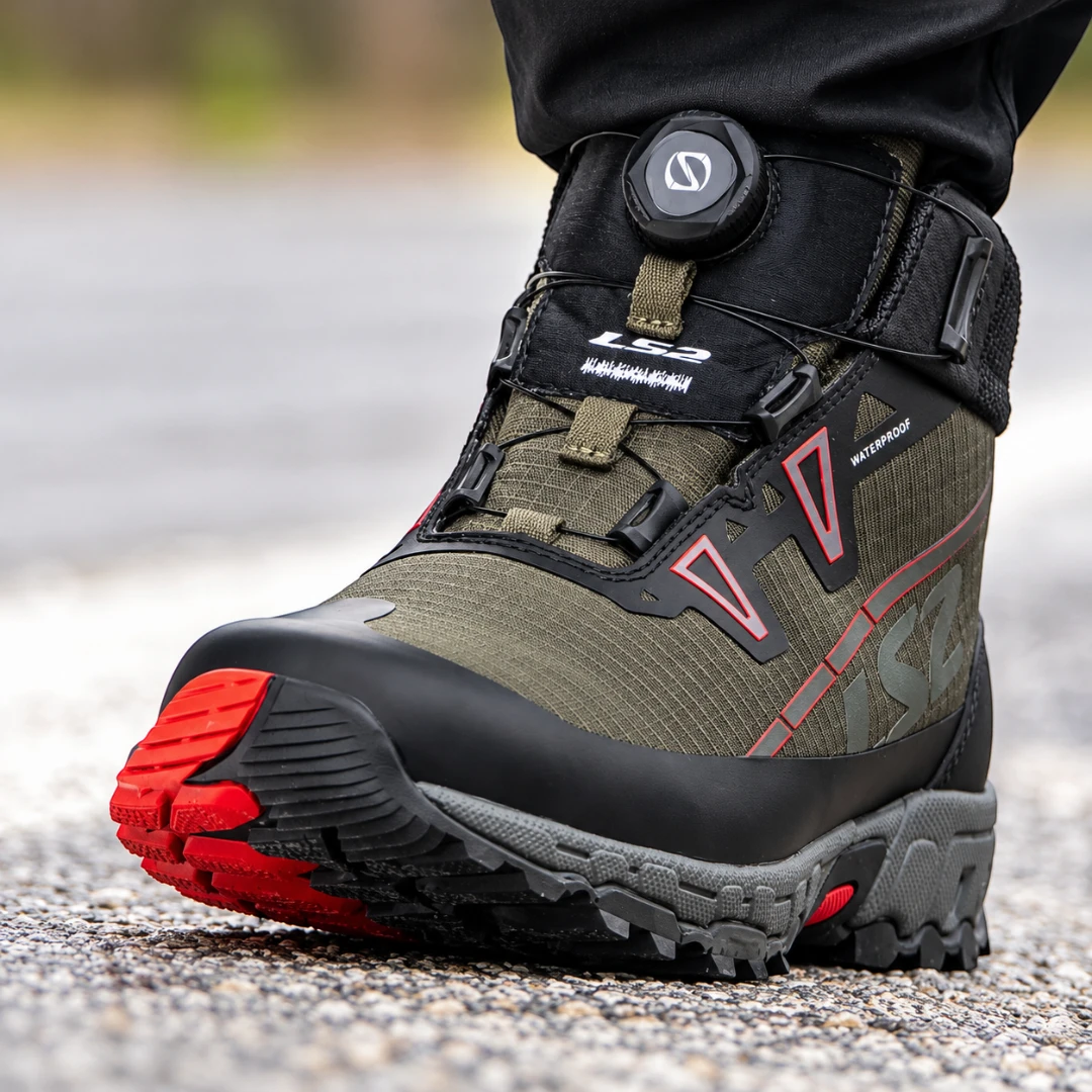 LS2 Trekker olive green waterproof adventure motorcycle boots with SPINON lacing and red sole details.