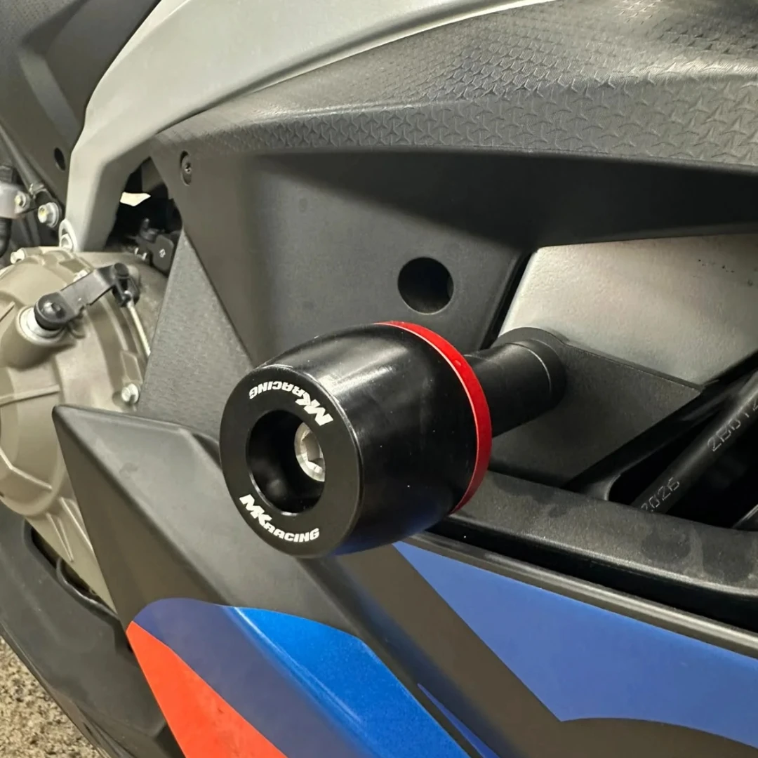 MK Racing black Delrin frame slider with red accent ring installed on an Aprilia RS 457 motorcycle
