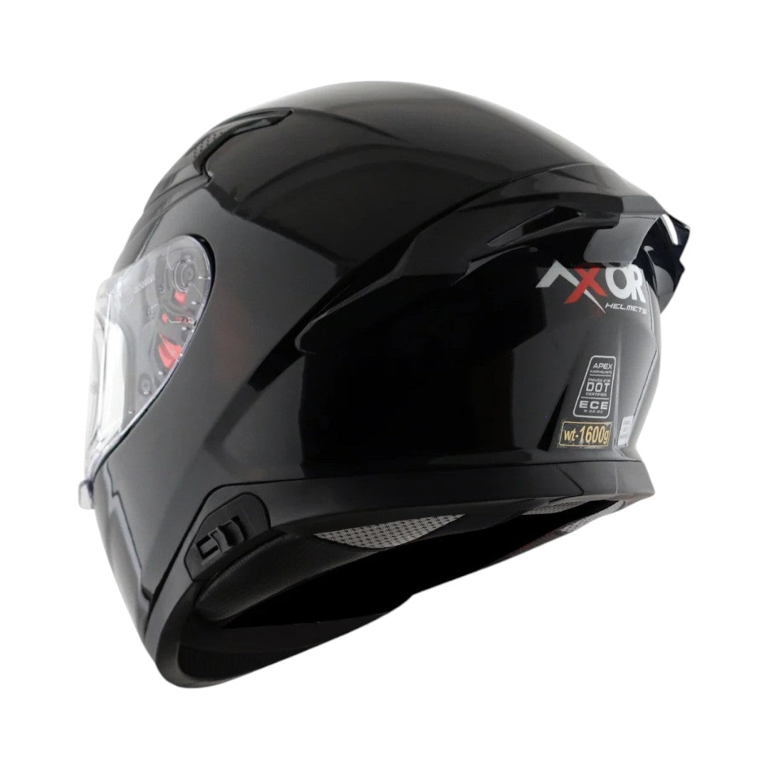 Motodrift Axor Apex solid black full-face motorcycle helmet with rear spoiler and visor from a side angle