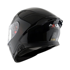 Motodrift Axor Apex solid black full-face motorcycle helmet with rear spoiler and visor from a side angle