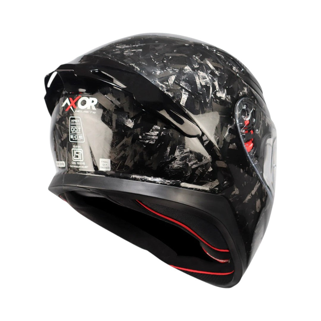 Motodrift Axor Apex forged carbon motorcycle helmet with integrated rear spoiler and safety certification labels.