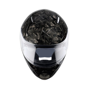 Motodrift Axor Apex forged carbon motorcycle helmet with a clear visor, front view showing the unique carbon fiber pattern.