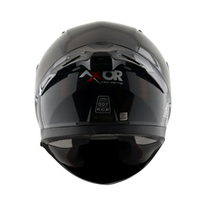 Motodrift Axor Apex Solid full-face motorcycle helmet in glossy black, rear view showing certification labels.