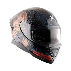 Motodrift Axor Apex Trance full-face motorcycle helmet in black with intricate orange and blue graphic detailing.