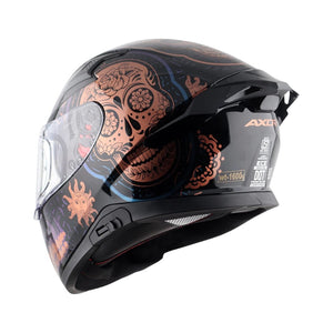Motodrift Axor Apex Trance full-face helmet in black with copper skull and sun graphic design, rear side view.