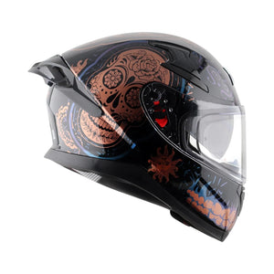 Motodrift Axor Apex Trance full-face helmet in black with copper skull and floral graphic design, side profile view.