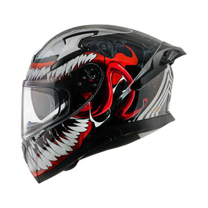 Motodrift Axor Apex Marvel Venom full-face motorcycle helmet with black, red, and white graphic design and spoiler.