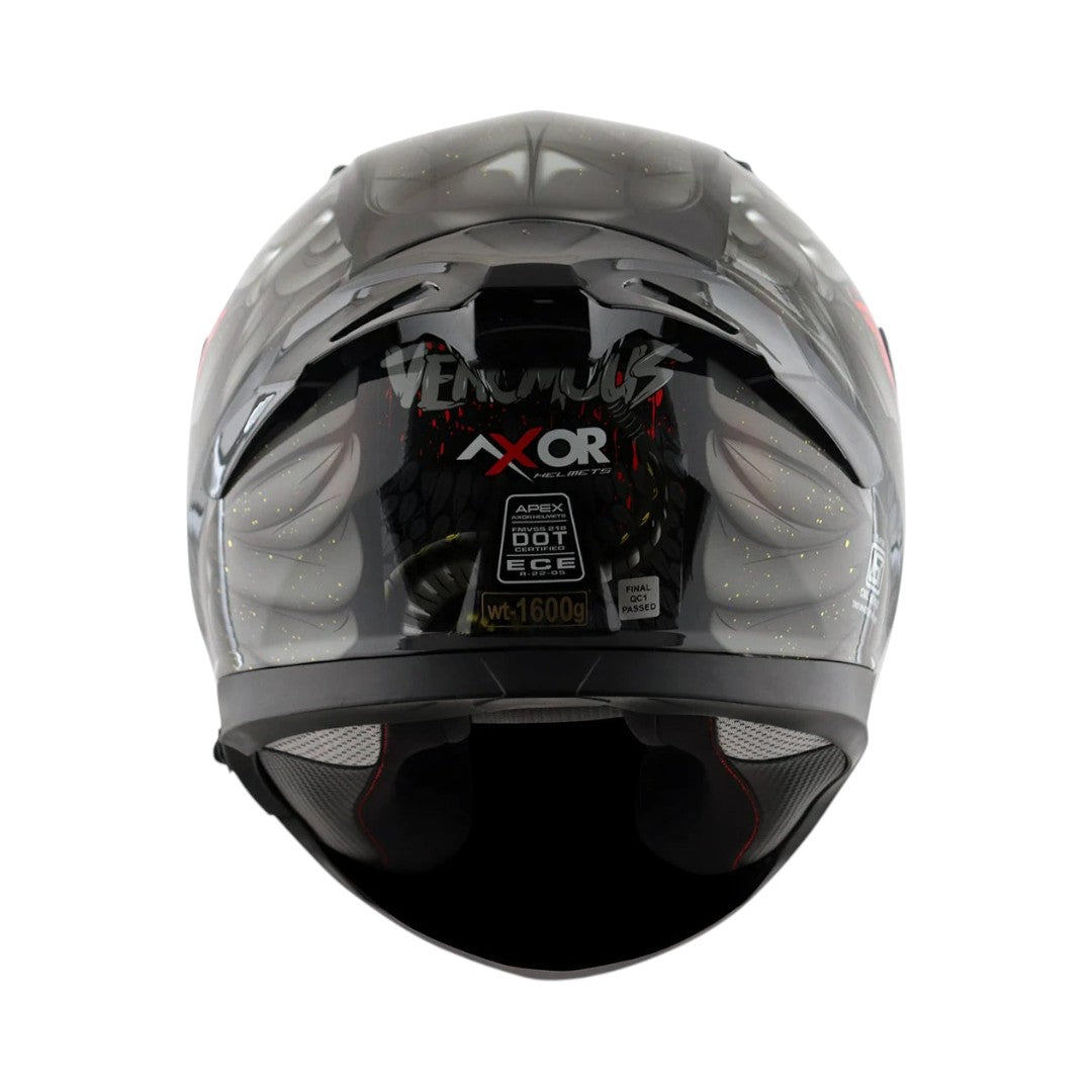 Motodrift Axor Apex Venomous helmet rear view showing integrated spoiler, safety certification labels, and branding.