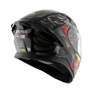 Motodrift Axor Apex Venomous helmet in black with red graphic details, showing the rear spoiler and safety labels.