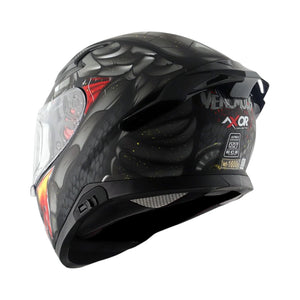 Motodrift Axor Apex Venomous helmet in black with graphic details, rear spoiler, and safety certification labels.