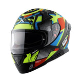 Motodrift Axor Apex Vivid full-face motorcycle helmet with vibrant multi-color geometric graphics and clear visor