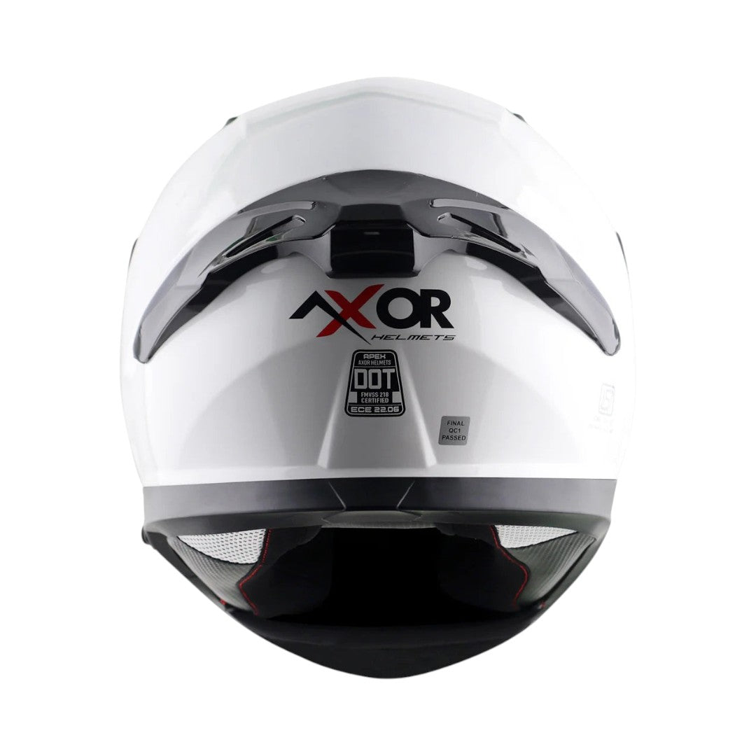 Motodrift Axor Apex solid white full-face motorcycle helmet, rear view showing ventilation and safety certifications.