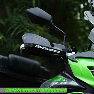 Motodrift Barkbusters VPS plastic handguards mounted on a green adventure motorcycle for wind and debris protection