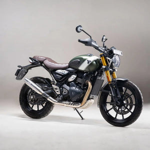 Motodrift silver Blaze performance exhaust installed on a green Triumph Scrambler 400X motorcycle