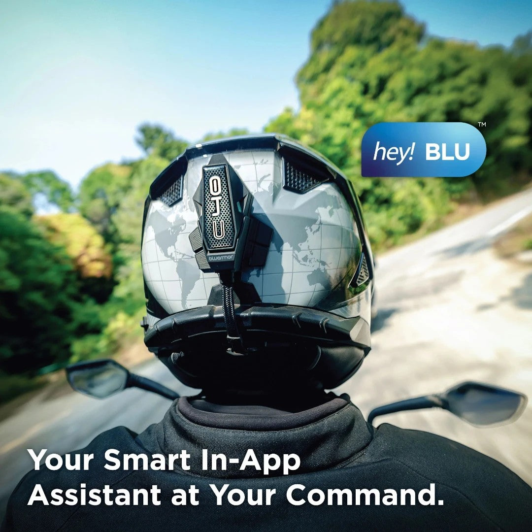 Motodrift BluArmor C40 Bluetooth mesh intercom mounted on a motorcycle helmet with a world map graphic on a road.