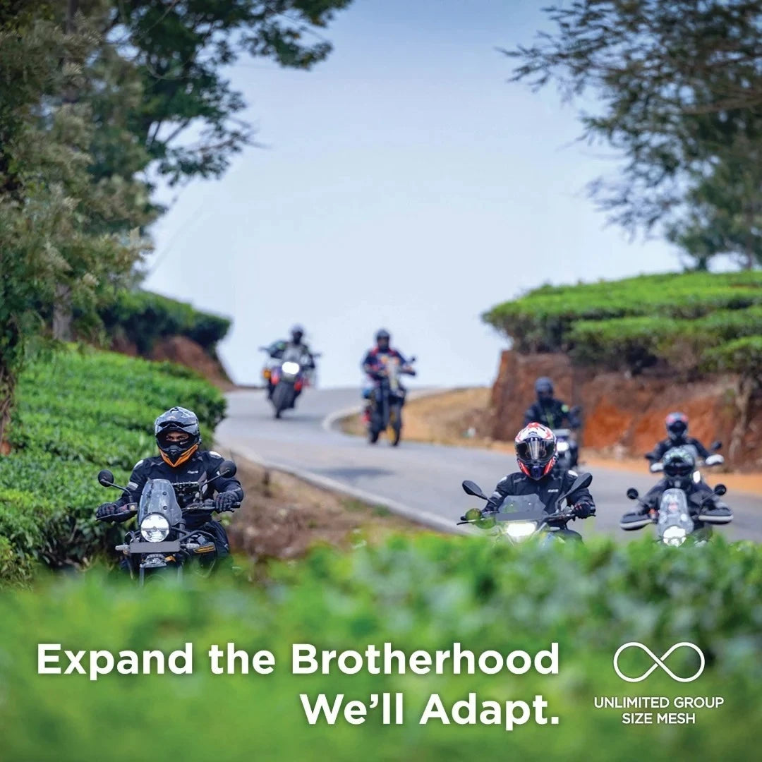 Motodrift BluArmor C60 motorcycle group riding on a scenic winding road using mesh intercom communication technology