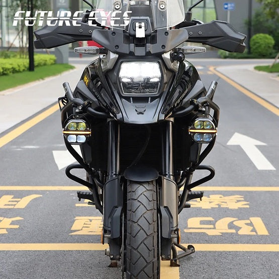 Motodrift Future Eyes Galaxy X100 LED auxiliary lights mounted on a black adventure motorcycle on a road