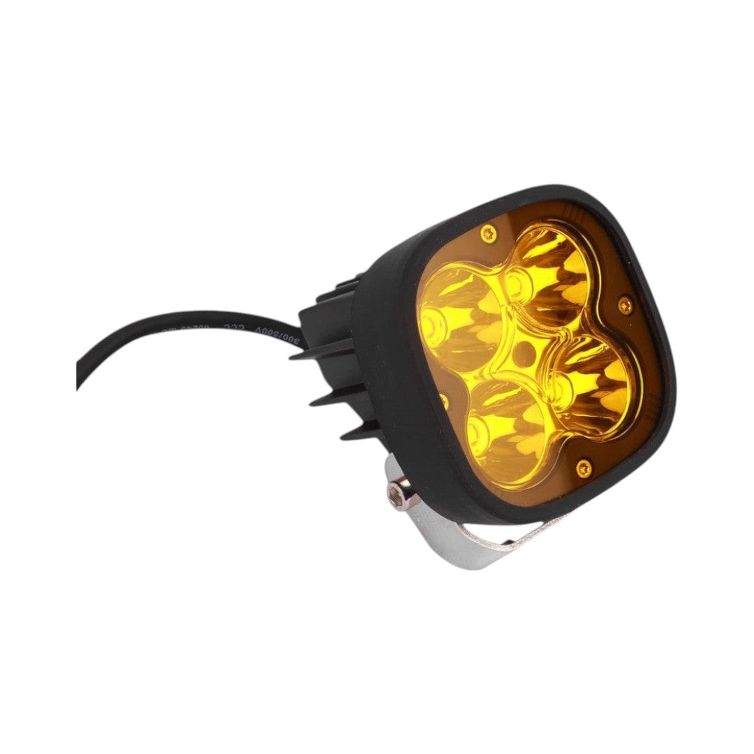 Motodrift HJG 4 LED square fog light with a yellow lens cap and black housing for motorcycles