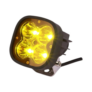 Motodrift HJG 4 LED square fog light with a yellow cap for motorcycles, providing powerful illumination.