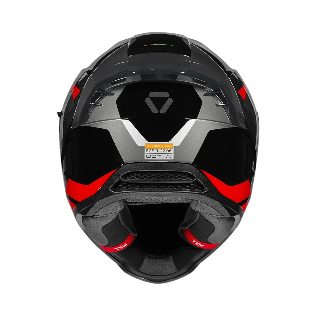 Motodrift Korda Evo Chief full-face motorcycle helmet in black and red, viewed from the rear with safety certifications.
