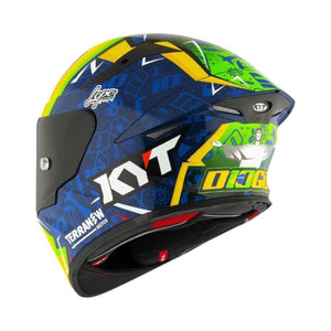 Motodrift KYT TT Revo Diogo Moreira replica motorcycle helmet with vibrant blue, yellow, and green racing graphics.