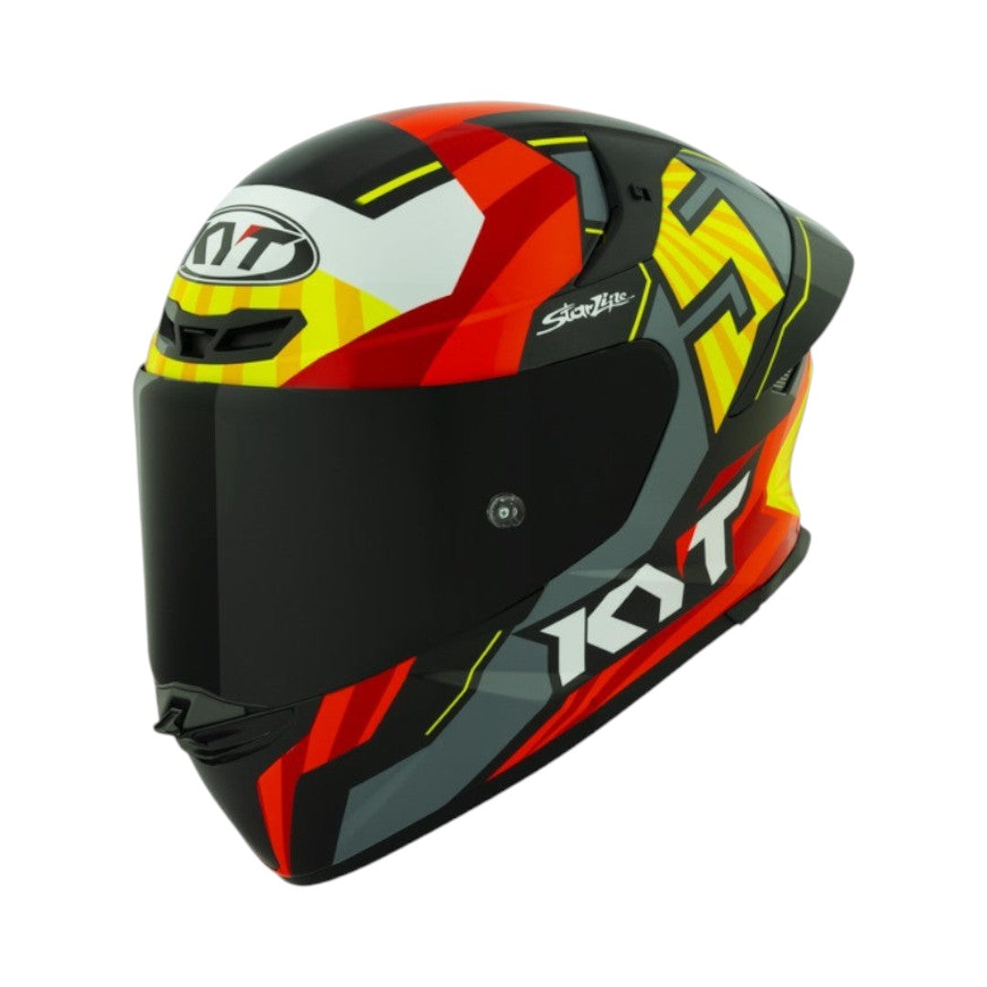 Motodrift KYT TT Revo Flux full-face motorcycle helmet in a glossy black, red, and yellow aerodynamic graphic design.