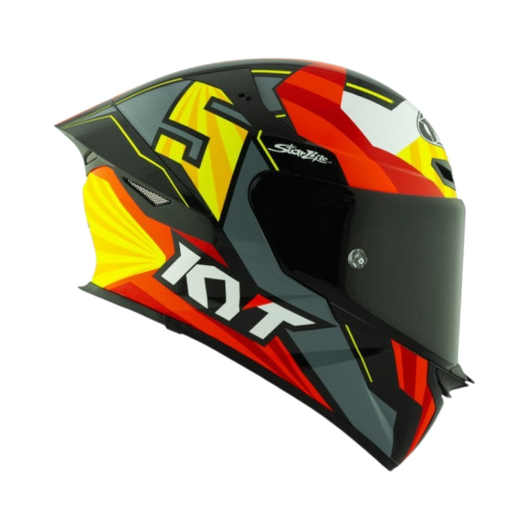 Motodrift KYT TT Revo Flux full-face motorcycle helmet in a vibrant red, yellow, and grey gloss graphic design.