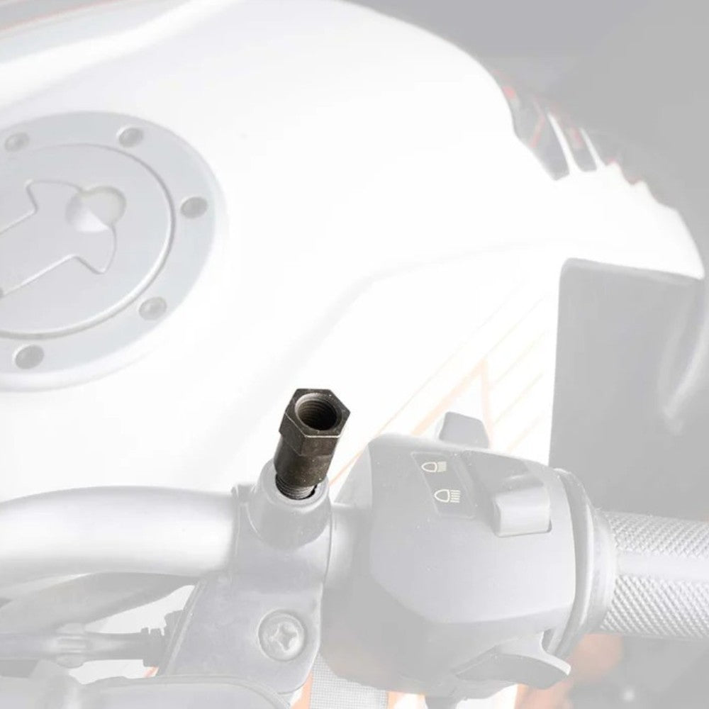 Motodrift black M10x1.25 motorcycle mirror adaptor with 20mm rise installed on a handlebar for improved visibility
