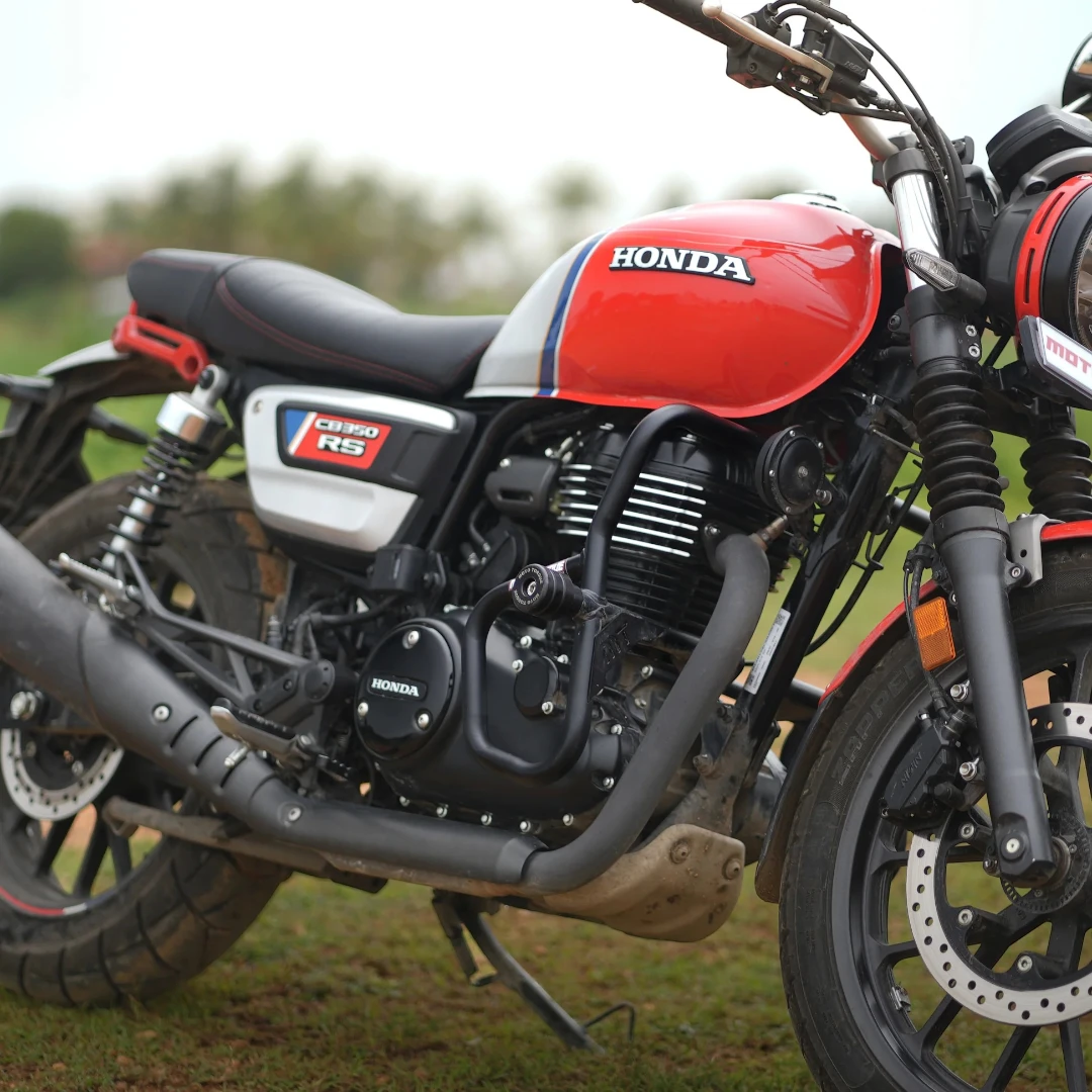 Motodrift Moto Torque V2.0 black steel crash guard installed on a red Honda CB350 RS motorcycle