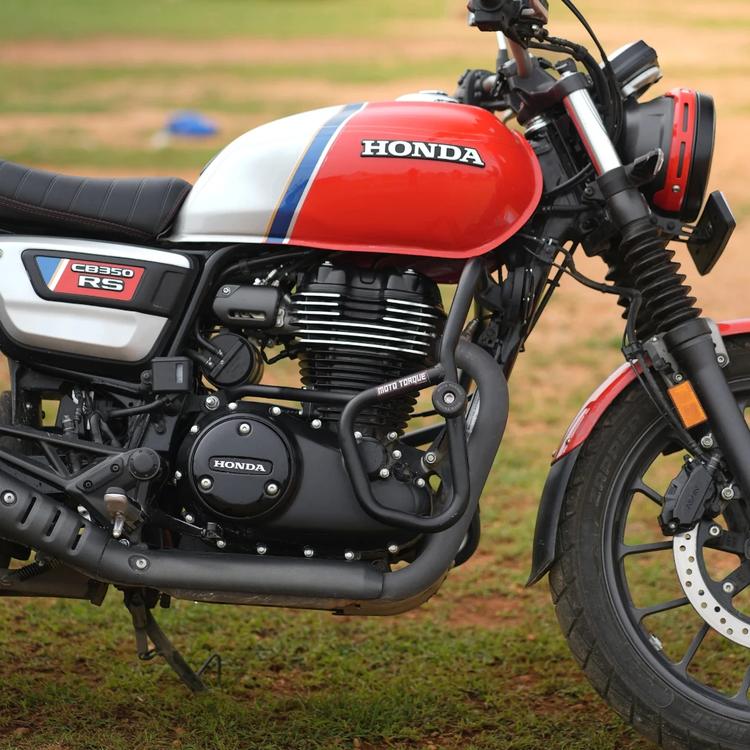 Motodrift Moto Torque V2.0 black steel crash guard installed on a red and white Honda CB350 RS motorcycle