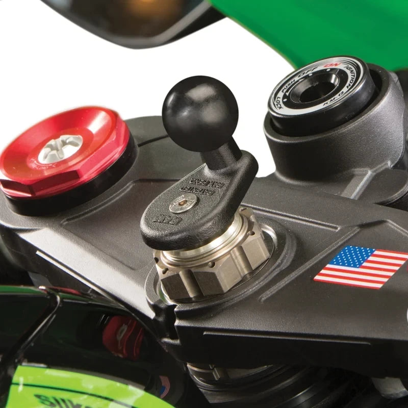 Motodrift RAM fork stem mount hardware pack installed on a motorcycle triple tree with a black ball base