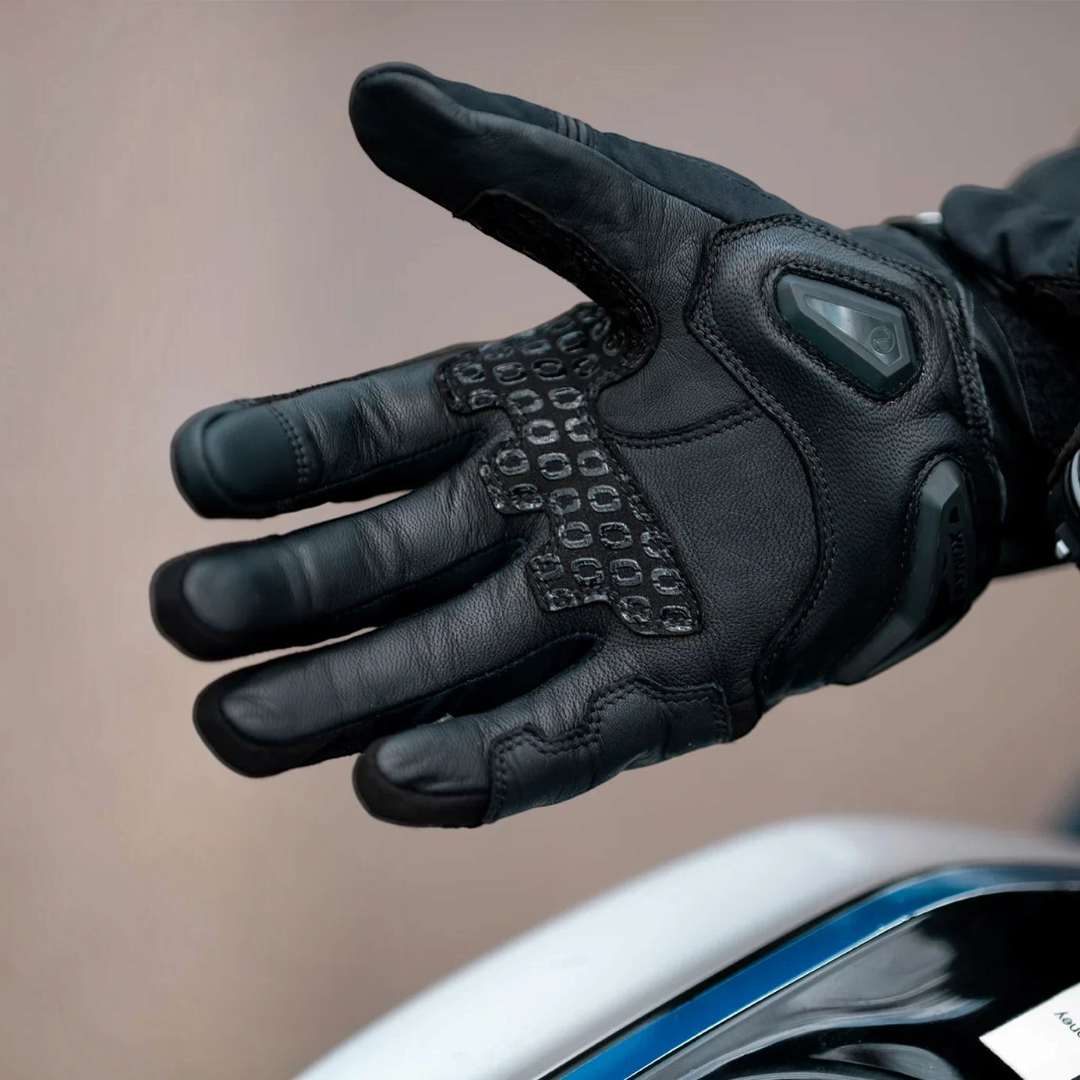 Motodrift Rynox Delta GT black leather motorcycle riding gloves with TPU knuckle protection and silicone grip detail