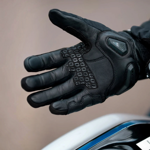 Motodrift Rynox Delta GT black leather motorcycle riding gloves with TPU knuckle protection and silicone grip detail
