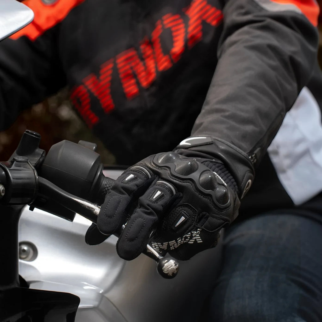 Motodrift Rynox Delta GT black leather semi-gauntlet motorcycle riding gloves with TPU knuckle protection on handlebars