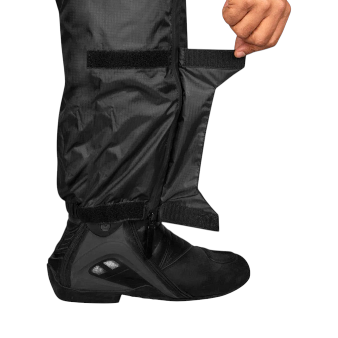 Motodrift Rynox H2GO PRO black waterproof rain pant leg with YKK Aquaguard side zipper over a motorcycle boot