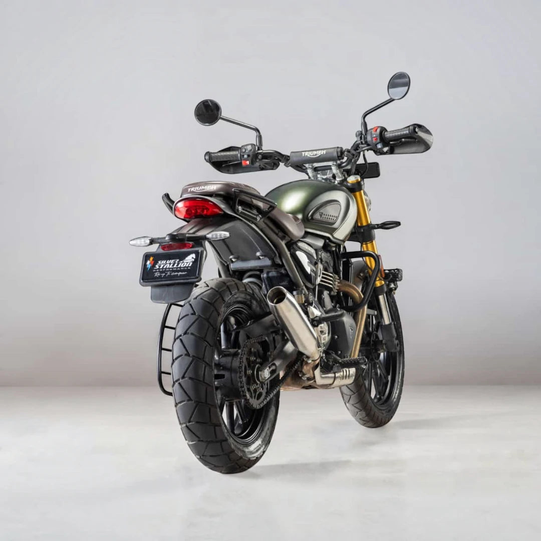 Motodrift Silver Stallion Blaze performance exhaust installed on a Triumph Scrambler 400X, rear view.