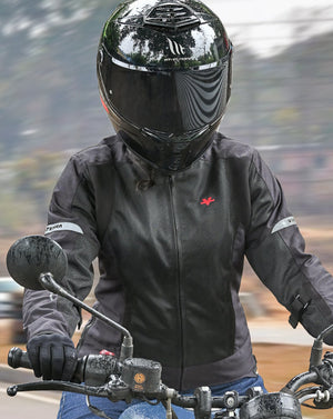 Motodrift ViaTerra Ellis women's black mesh riding jacket with reflective details worn by a rider on a motorcycle