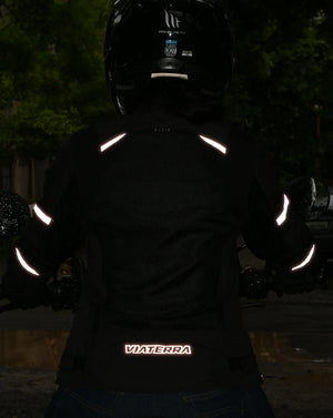 Motodrift ViaTerra Ellis women's black riding jacket with reflective safety strips visible in low light conditions