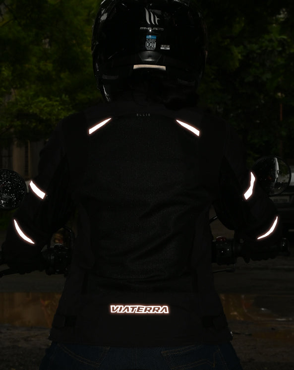 Motodrift ViaTerra Ellis women's black riding jacket with reflective safety strips visible in low light conditions