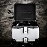 Motodrift ZANA 45L aluminium motorcycle top box in silver and black with open lid showing inner liner and storage